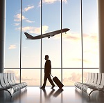 young man in airport and airplane in sky